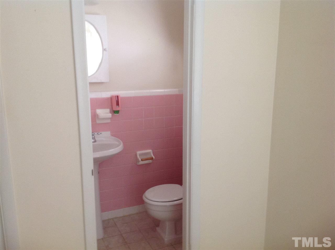145 Creech Road Garner, NC 27529 - Photo 15 of 15 a bathroom with a granite countertop toilet and a sink