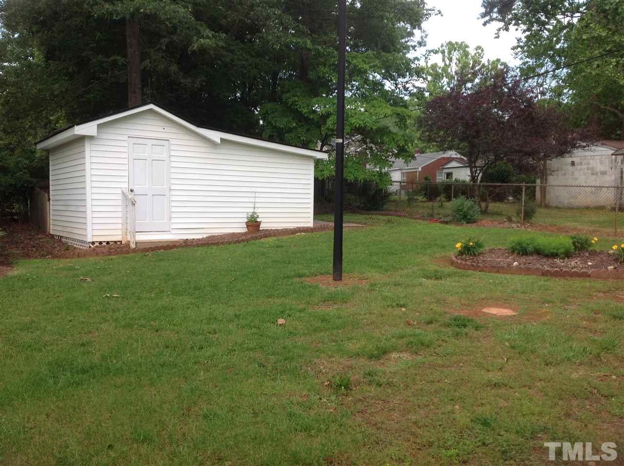145 Creech Road Garner, NC 27529 - Photo 3 of 15 a front view of a house with garden