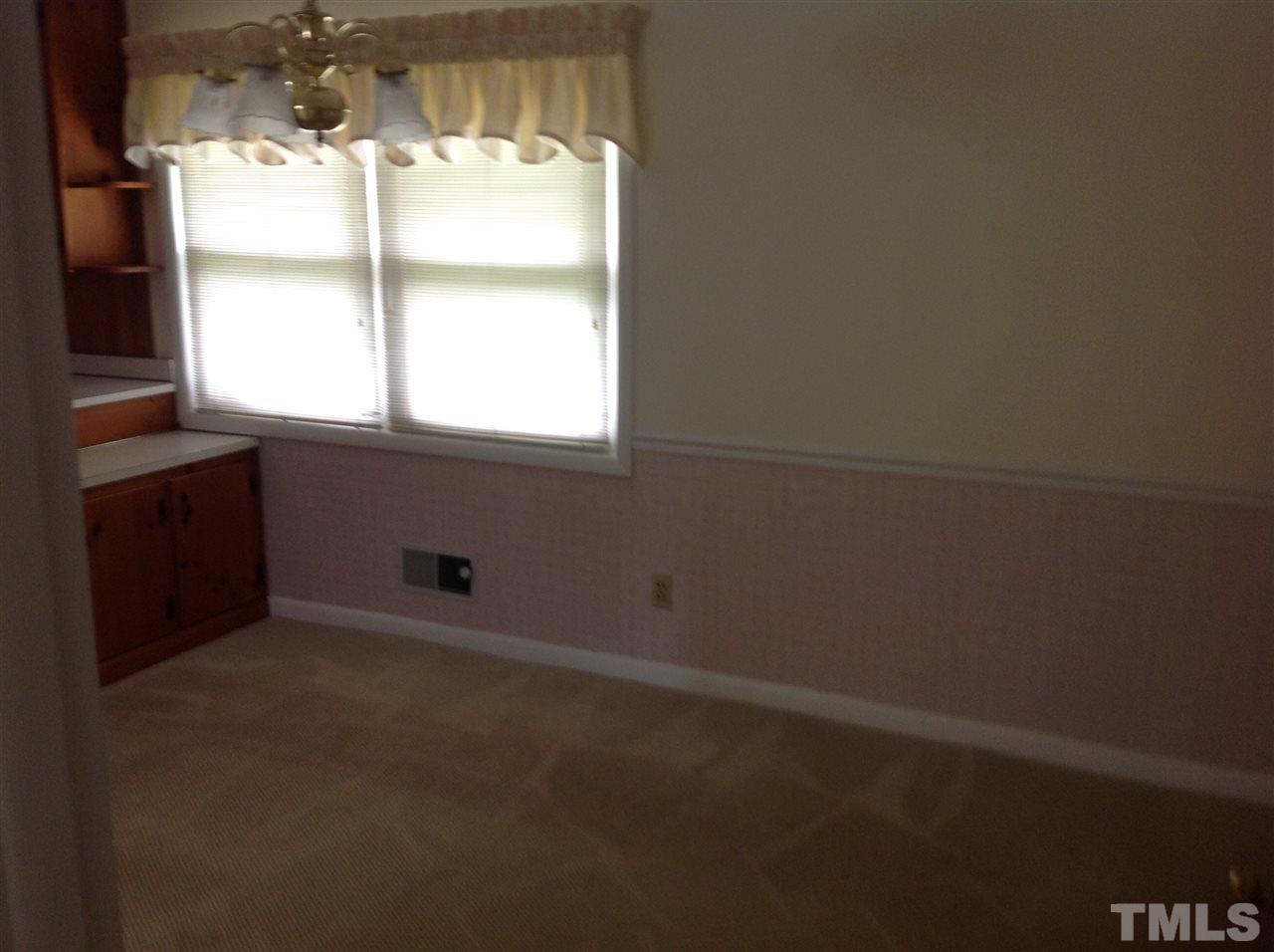 145 Creech Road Garner, NC 27529 - Photo 10 of 15 a room that has a window in it