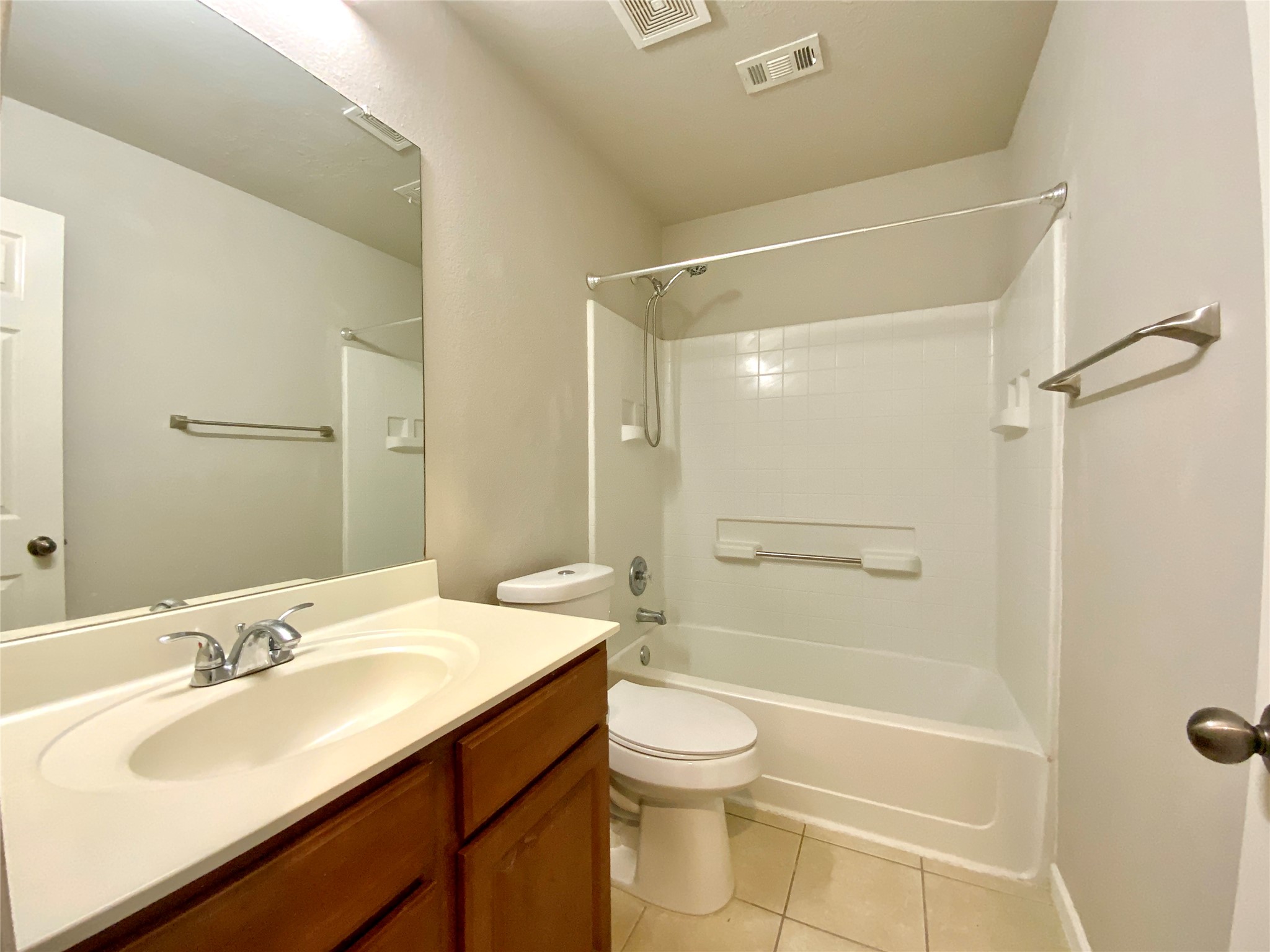 18704 Silent Water Way Pflugerville, TX 78660 - Photo 10 of 14 a bathroom with a sink mirror toilet and bathtub