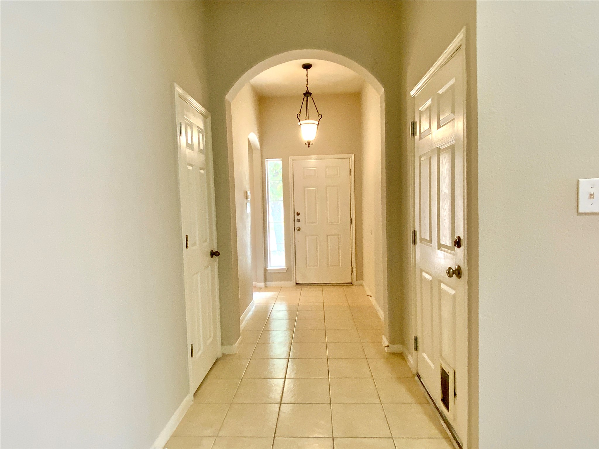 18704 Silent Water Way Pflugerville, TX 78660 - Photo 3 of 14 a view of a hallway with wooden shelves