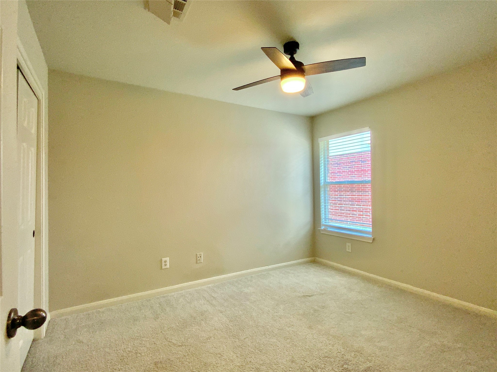 18704 Silent Water Way Pflugerville, TX 78660 - Photo 7 of 14 an empty room with a window and a fan