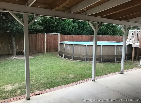a view of backyard with green space
