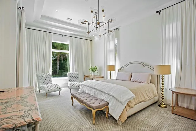 a spacious bathroom with a shower sink and mirror