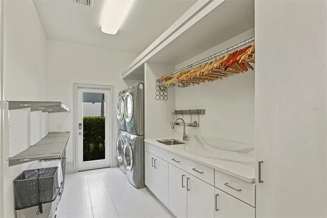 a bathroom with a granite countertop sink a toilet and a mirror