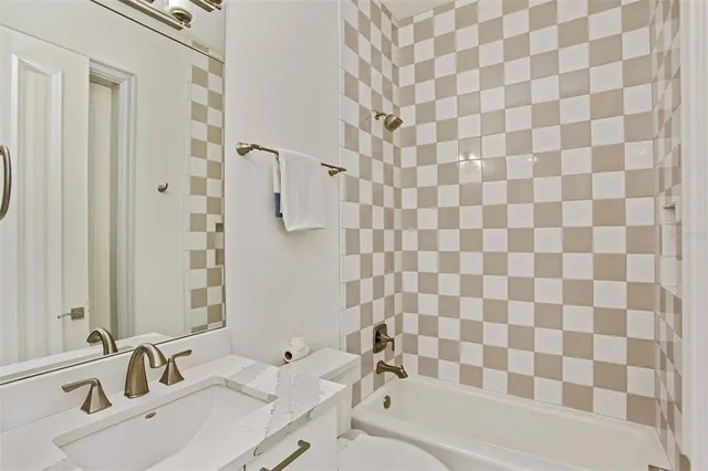 a view of a patio with couches table and chairs and potted plants