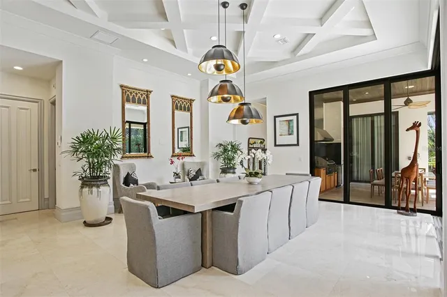 a view of a kitchen with a sink dishwasher stove and living room view