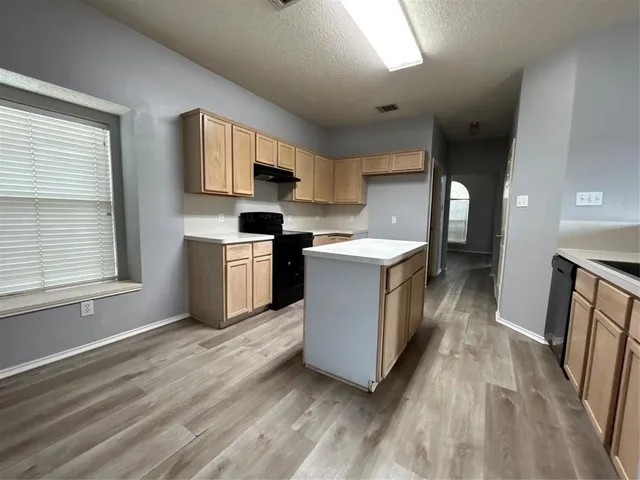 a view of a livingroom with wooden floor