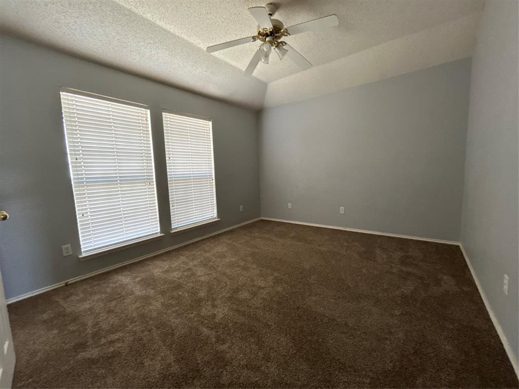 2620 Ridgebrook Court Mesquite, TX 75181 - Photo 19 of 24 an empty room with windows and fan
