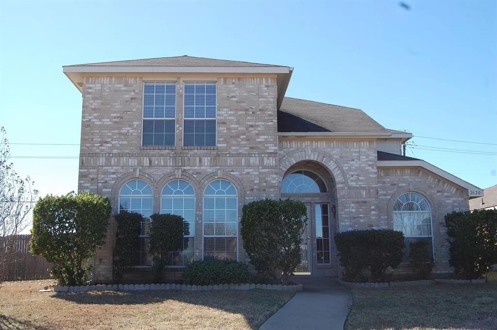 2620 Ridgebrook Court Mesquite, TX 75181 - Photo 2 of 24 a front view of a house with garden