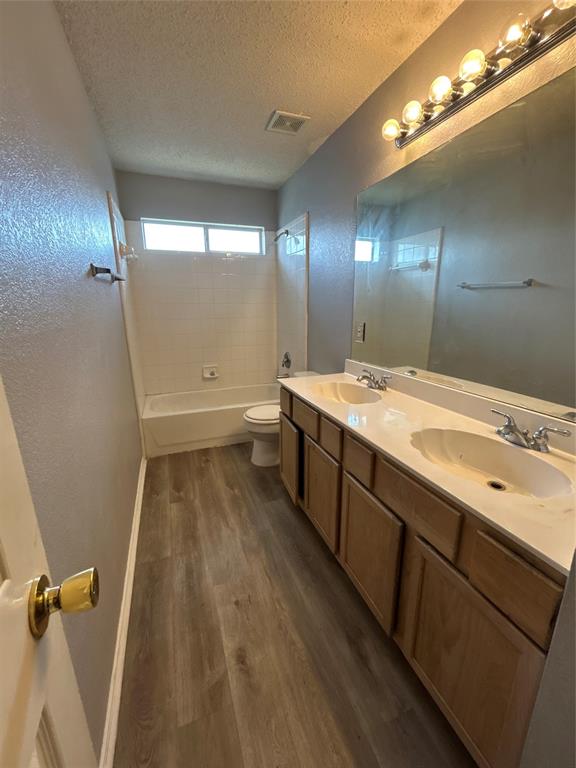 2620 Ridgebrook Court Mesquite, TX 75181 - Photo 22 of 24 a bathroom with a double vanity sink and a mirror
