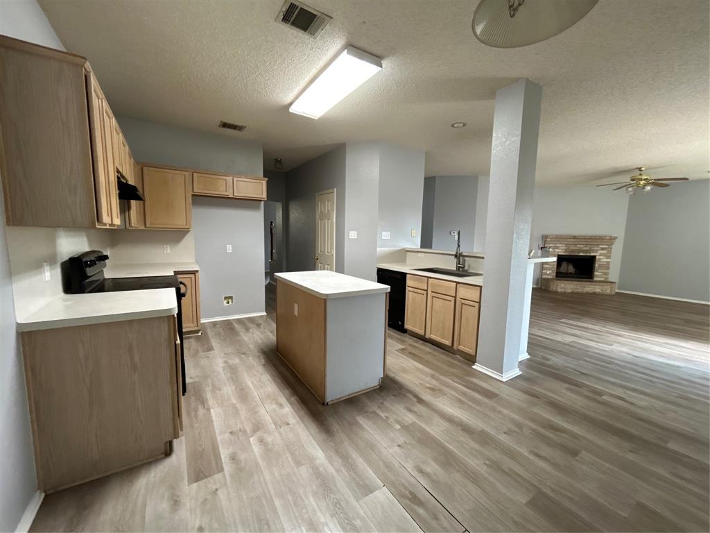 2620 Ridgebrook Court Mesquite, TX 75181 - Photo 24 of 24 a kitchen with a sink and a stove top oven