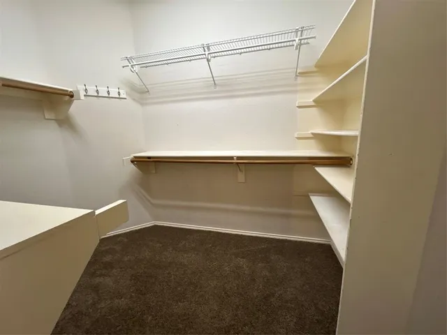 wooden floor in an empty room with a fireplace