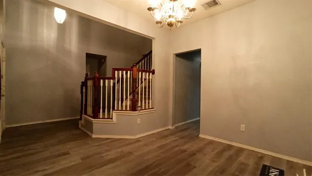 a view of a livingroom with wooden floor