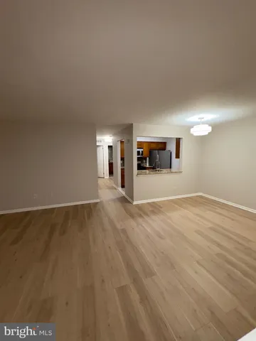 a view of a livingroom with wooden floor