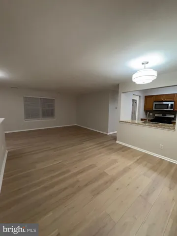 a view of livingroom and kitchen with furniture