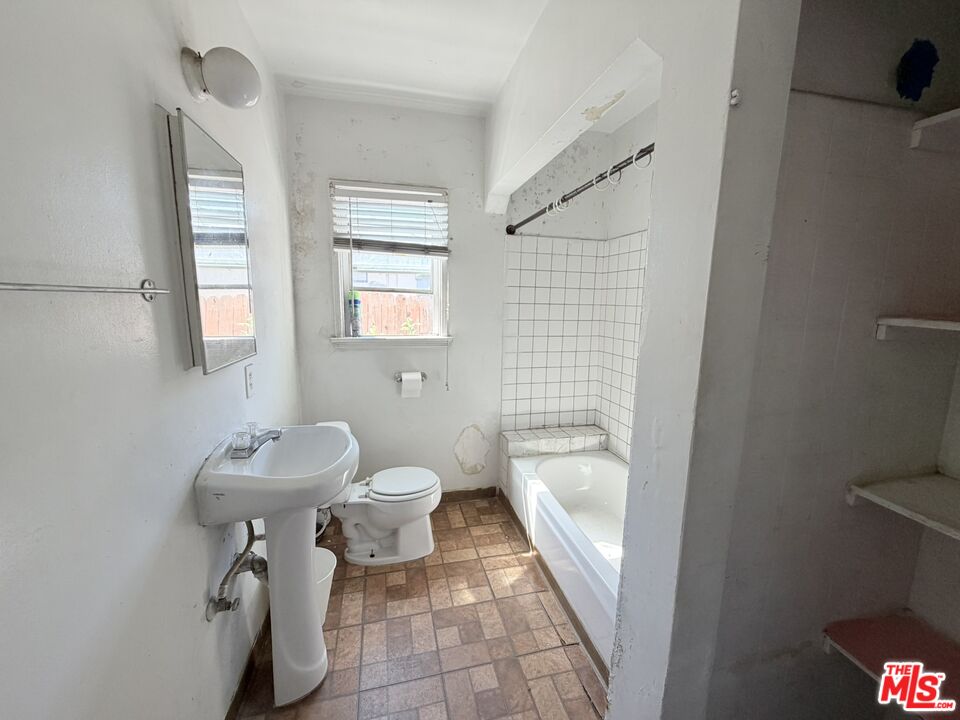 12918 Shreve Road Whittier, CA 90602 - Photo 34 of 42 a bathroom with a sink a toilet and shower