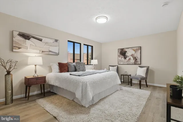 a bedroom with a bed and a desk