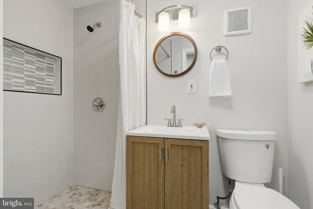a bathroom with a toilet and a sink