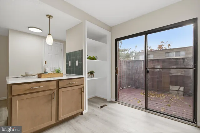 a bathroom with a shower sink and mirror
