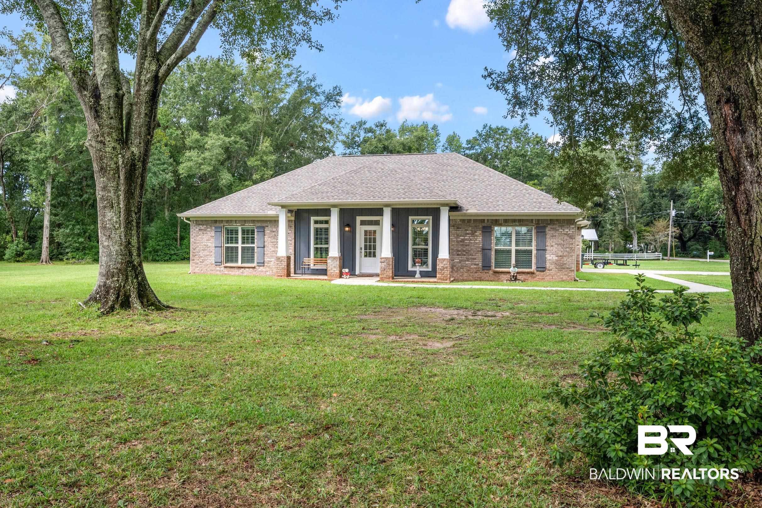 1700 South Juniper Street Foley, AL 36535 - Photo 6 of 51 View of front facade with a front lawn