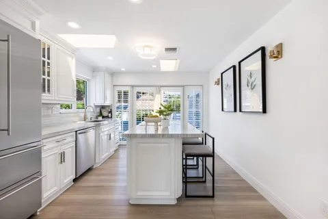 a bedroom with a large bed and a large window