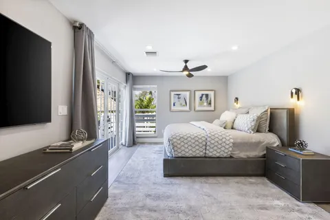 a bathroom with double vanity sink and two mirror
