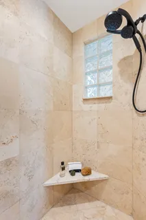 a bathroom with a sink toilet and mirror
