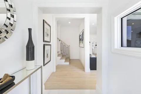 a bathroom with a granite countertop sink a toilet and shower