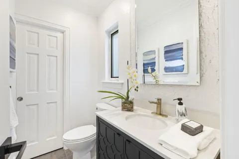 a view of a chairs and table in a patio