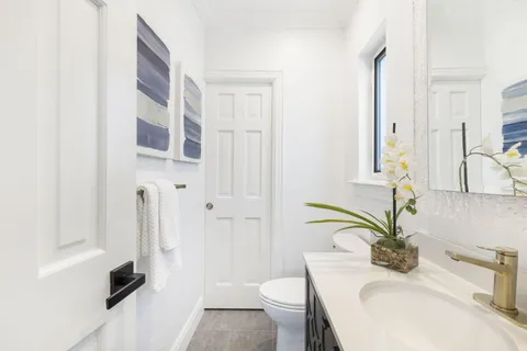 a view of a patio with table and chairs