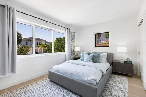 a view of a house with swimming pool and sitting area