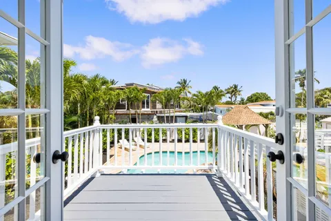 a aerial view of a house with a yard and potted plants