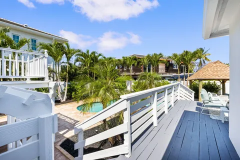 an aerial view of residential houses with outdoor space and street view