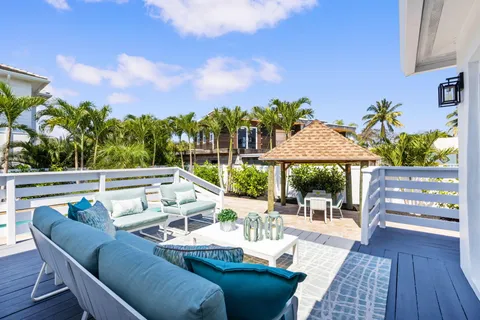 an aerial view of residential houses with outdoor space and street view