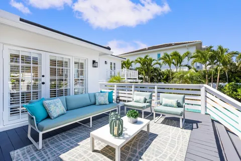 an aerial view of residential houses with outdoor space and street view