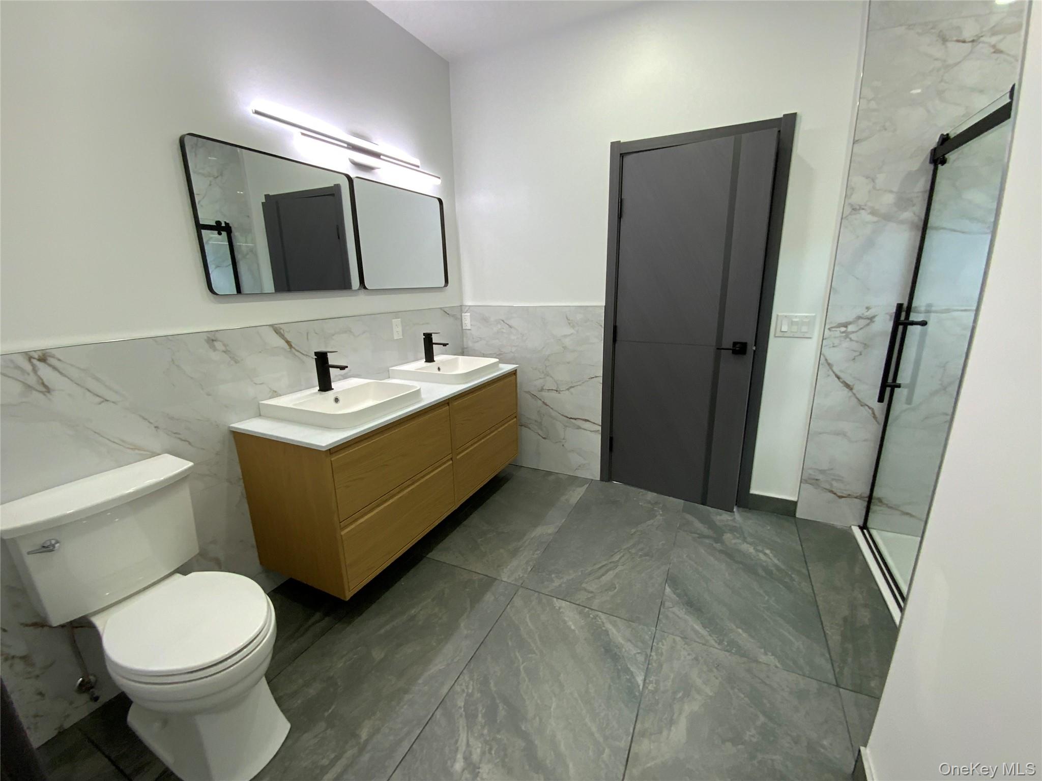 58 Dunn Town Road Wurtsboro, NY 12790 - Photo 14 of 36 a bathroom with a sink toilet and mirror