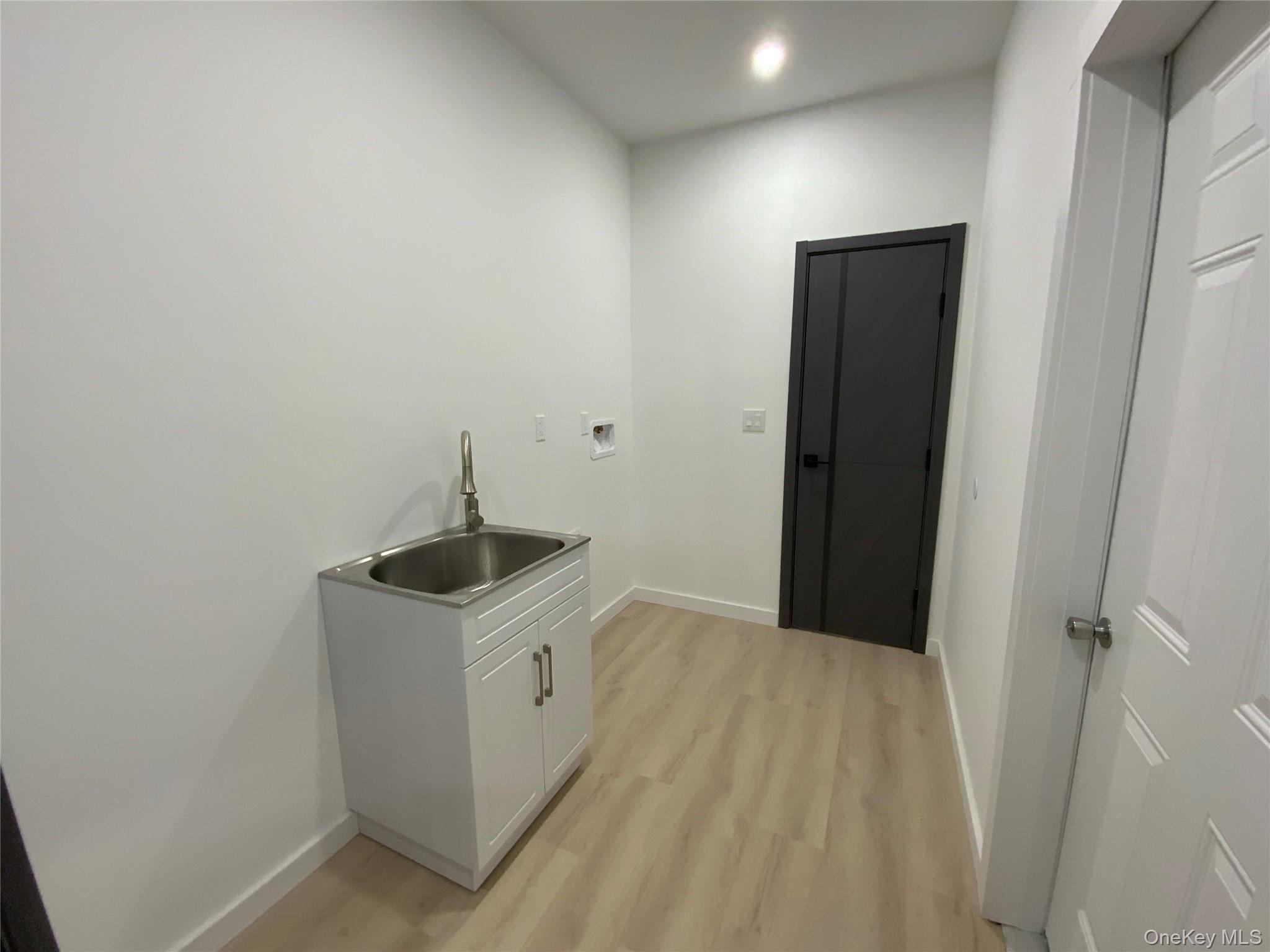 58 Dunn Town Road Wurtsboro, NY 12790 - Photo 21 of 36 a kitchen with a sink a stove and refrigerator