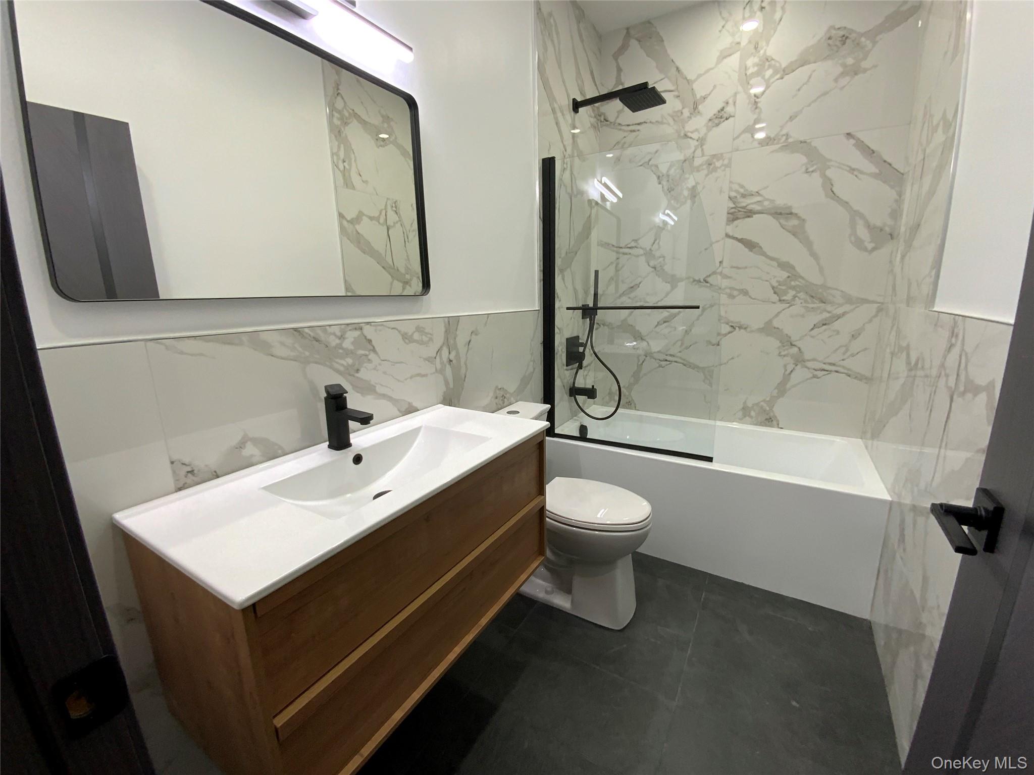 58 Dunn Town Road Wurtsboro, NY 12790 - Photo 25 of 36 a bathroom with a sink mirror toilet and bathtub