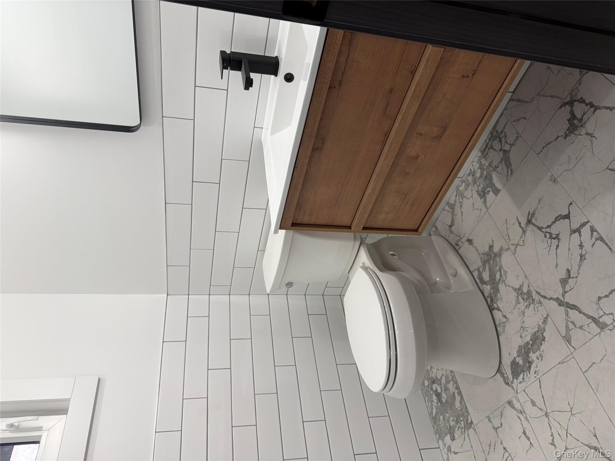 58 Dunn Town Road Wurtsboro, NY 12790 - Photo 27 of 36 a bathroom with a toilet and a sink