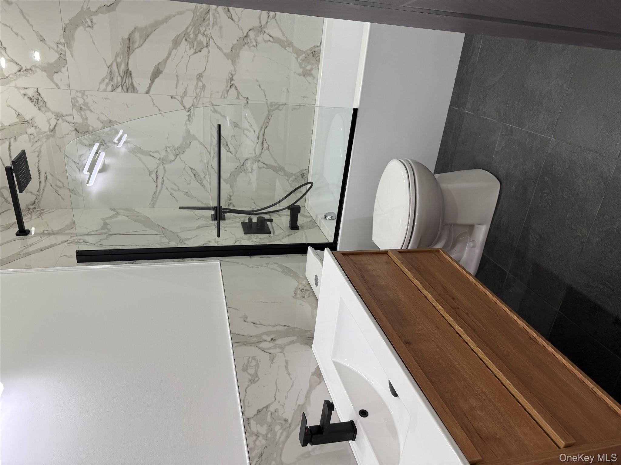 58 Dunn Town Road Wurtsboro, NY 12790 - Photo 30 of 36 a bathroom with a sink a toilet and shower