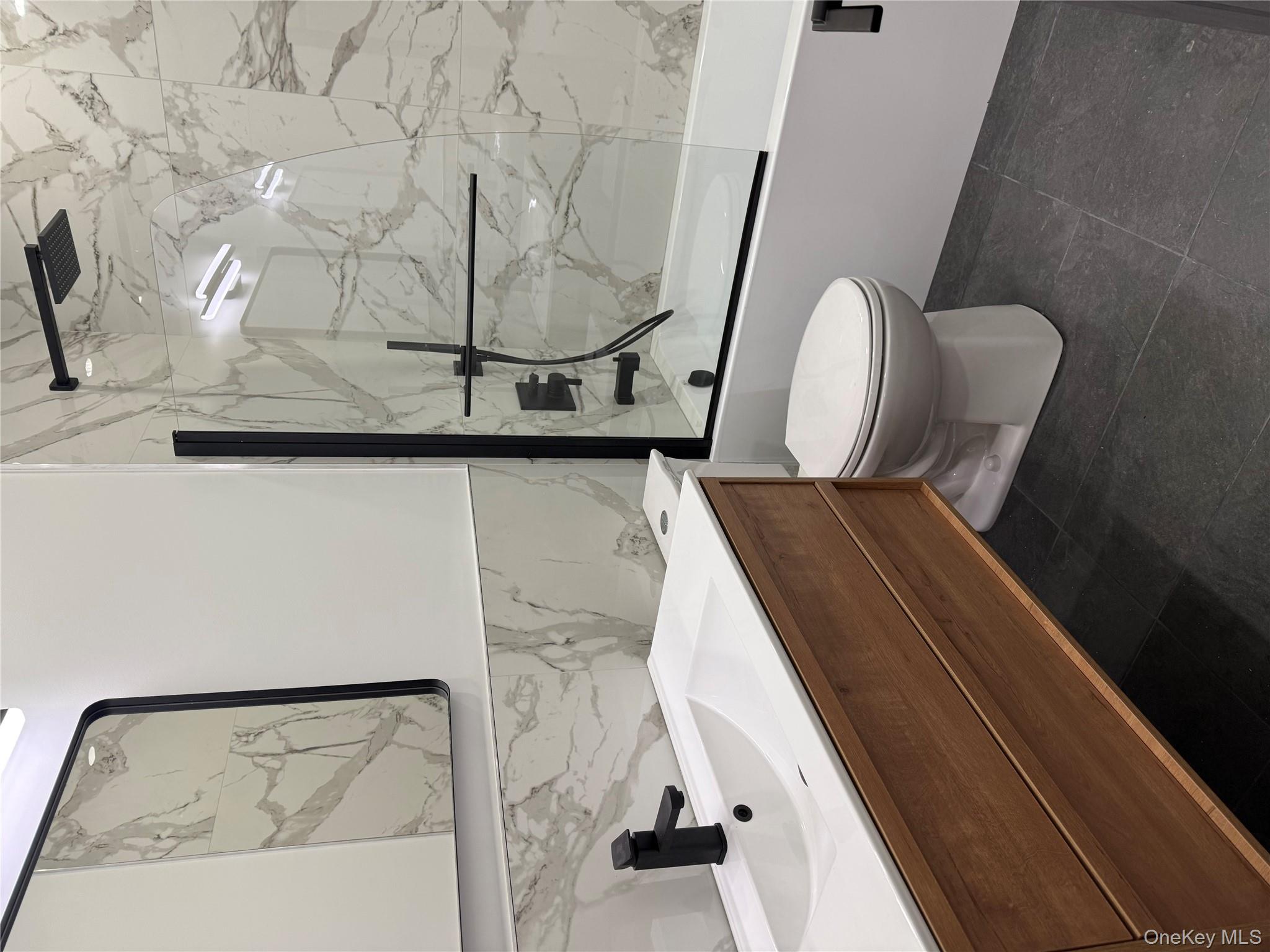 58 Dunn Town Road Wurtsboro, NY 12790 - Photo 31 of 36 a bathroom with a toilet sink and mirror