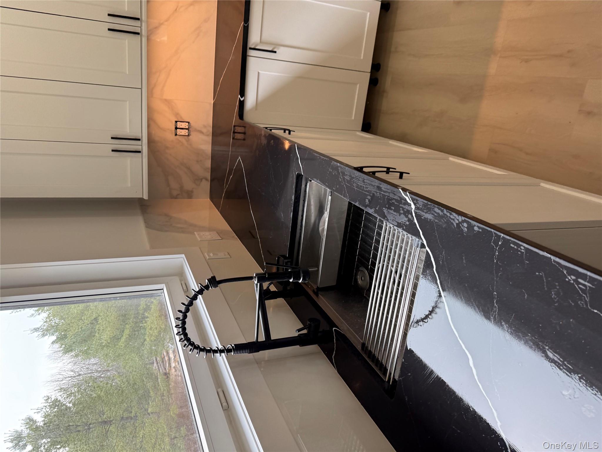 58 Dunn Town Road Wurtsboro, NY 12790 - Photo 33 of 36 a kitchen with a stove and a microwave