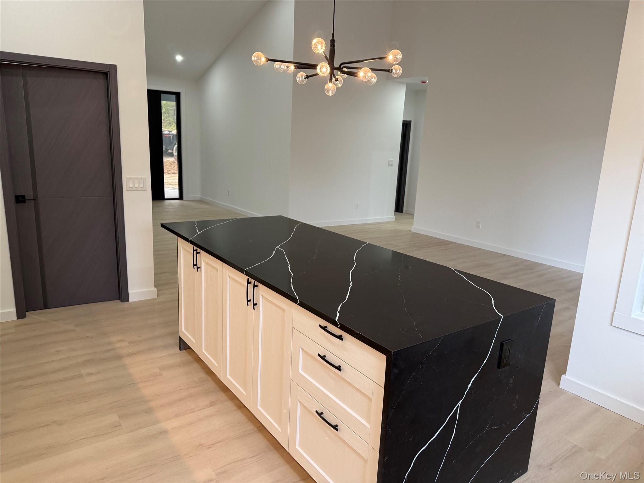 58 Dunn Town Road Wurtsboro, NY 12790 - Photo 34 of 36 a kitchen with granite countertop a refrigerator and a sink