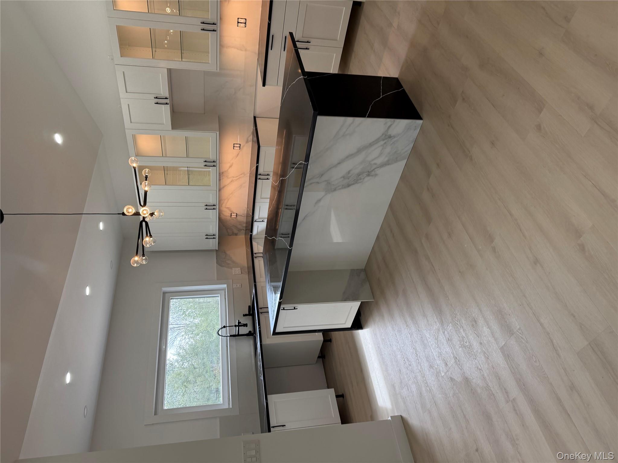 58 Dunn Town Road Wurtsboro, NY 12790 - Photo 35 of 36 a large kitchen with granite countertop a large counter top a sink and stainless steel appliances