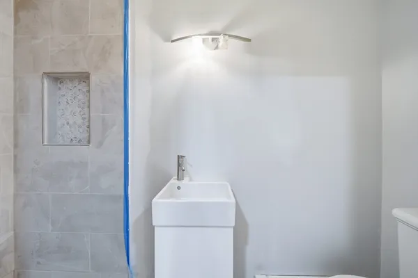 a bathroom with a sink and vanity
