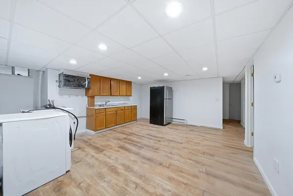a view of a kitchen with a sink and cabinets