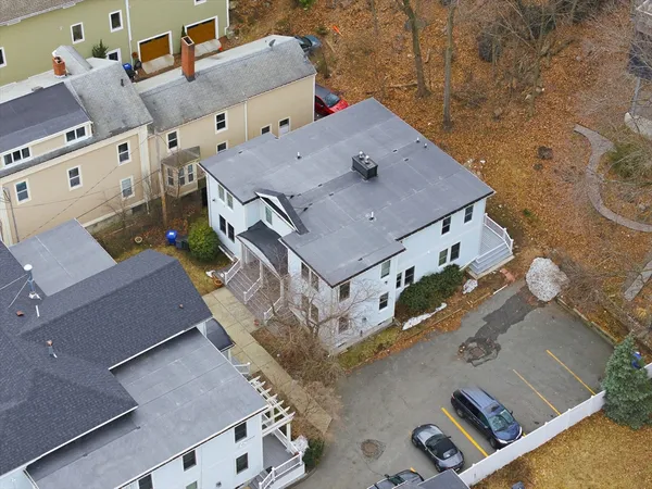 an aerial view of a house with a swimming pool