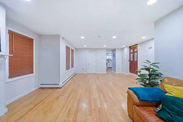 a room with furniture and a potted plant