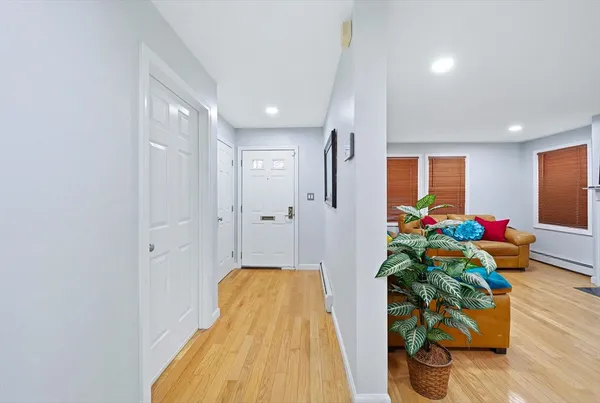 a view of entryway with wooden floor